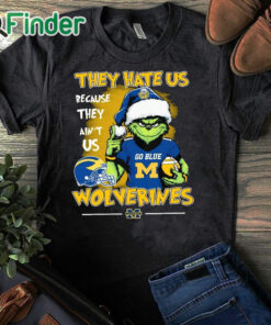 black T shirt They Hate Us Because Ain't Us Michigan Wolverines Go Blue The Grinch Christmas Shirt