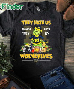 black T shirt They Hate Us Because Ain't Us Michigan Wolverines The Grinch Christmas Shirt