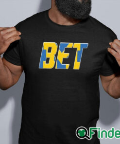 black shirt BET Several Michigan football players shirt