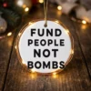 fund people not bombs ornament