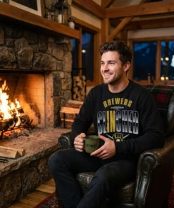 brewers clinched postseason locker room 2026 black sweatshirt stone fireplace
