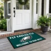fly eagles fly welcome to our nest midnight green doormat mockup 2