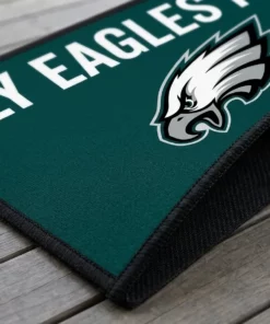 fly eagles fly welcome to our nest midnight green doormat mockup 3
