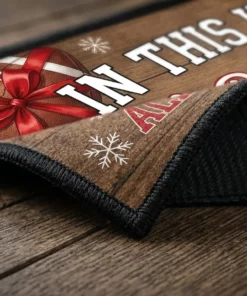 In This House We Praise Jesus And Watch Football All Christmas Day Doormat - Lifestyle Model Mockup