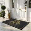 personalized monogram initial family name elegant black and gold doormat mockup 2