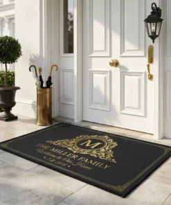 personalized monogram initial family name elegant black and gold doormat mockup 2