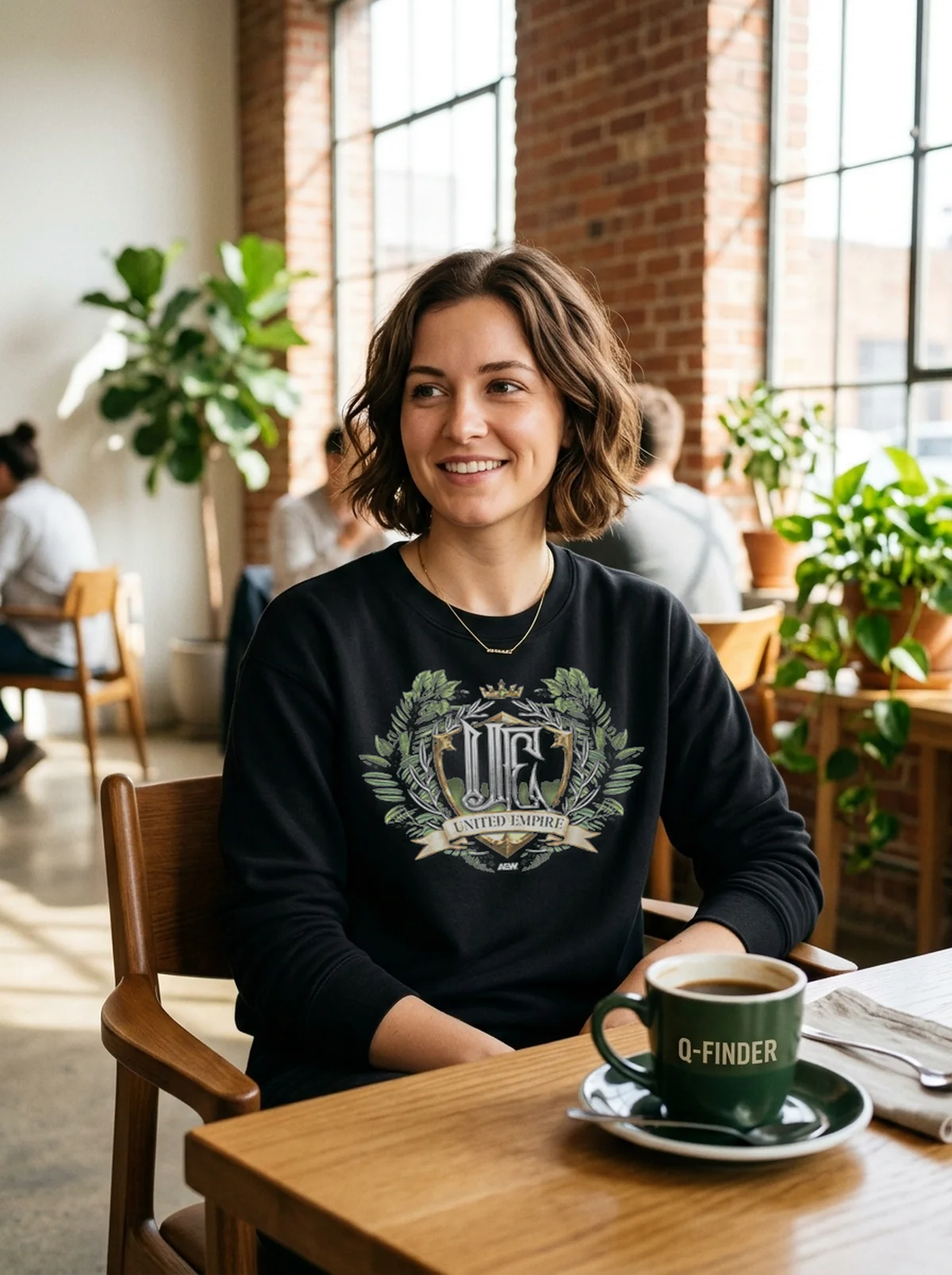 united empire expanded territory black sweatshirt artisan cafe United Empire - Expanded Territory T-Shirt - Close-up Graphic Detail Mockup