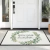 watercolor botanical eucalyptus leaves welcome to our home personalized doormat mockup 2