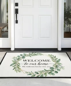 watercolor botanical eucalyptus leaves welcome to our home personalized doormat mockup 2